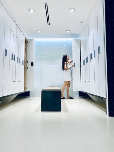 Woman standing in locker room