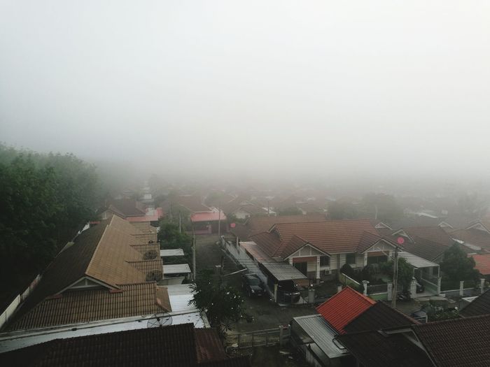 High angle view of houses in foggy weather