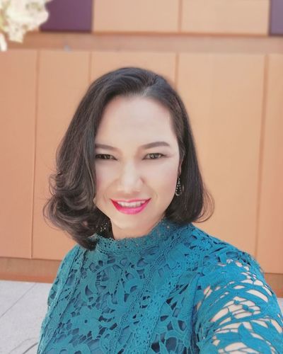 Portrait of smiling beautiful woman at home