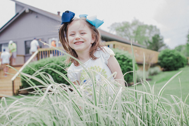 Portrait of cute girl smiling outdoors