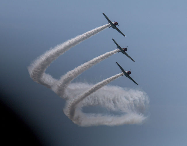 Three of the skytypers acrobatic airplane performance team at the jones beach air show.