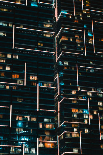 Full frame shot of illuminated buildings at night