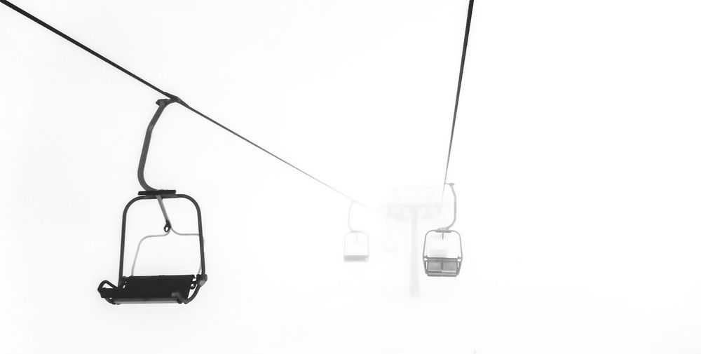 Overhead cable car against white background