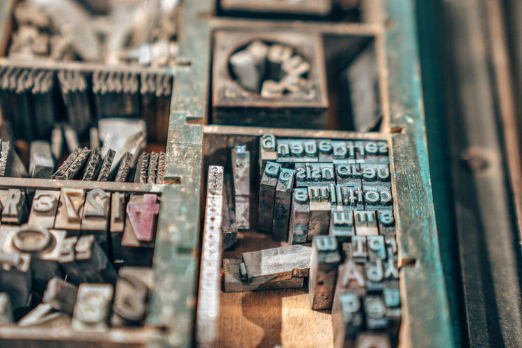 Old typography printing machine with letter samples.