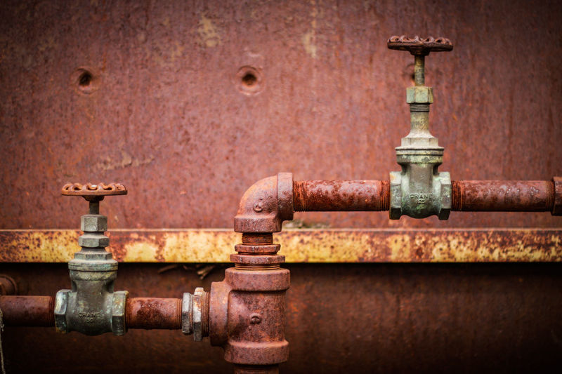 Close-up of rusty metallic pipeline