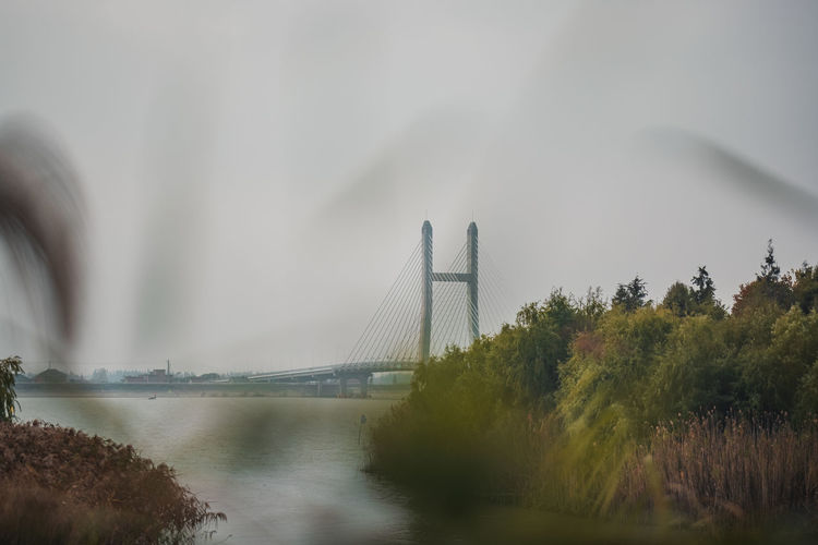 View of bridge over river against sky