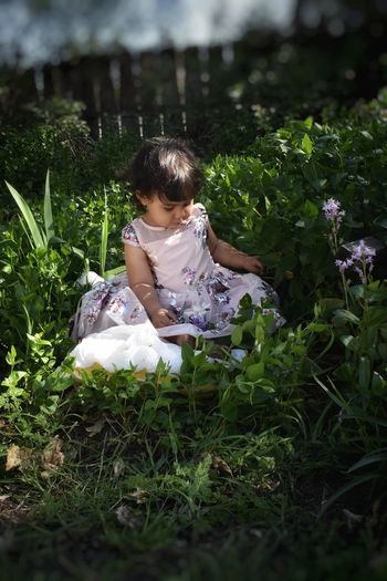Toddler in flower garden