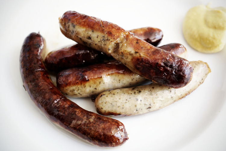 Close-up of roasted sausages in plate