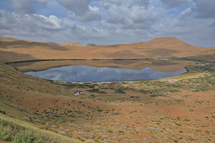 1074 lake zhalate-badain jaran desert-nomadic yurts-megadune and sky reflected. inner mongolia-china