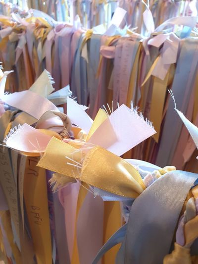 Close-up of clothes hanging on paper at market stall