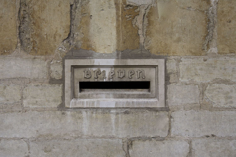 Letterbox slot on stone wall