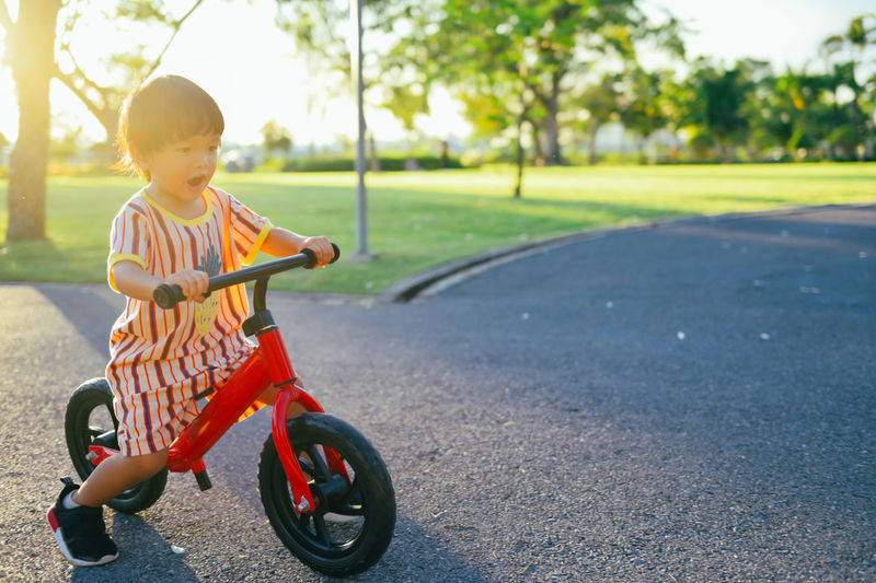 Portrait of boy standing on road