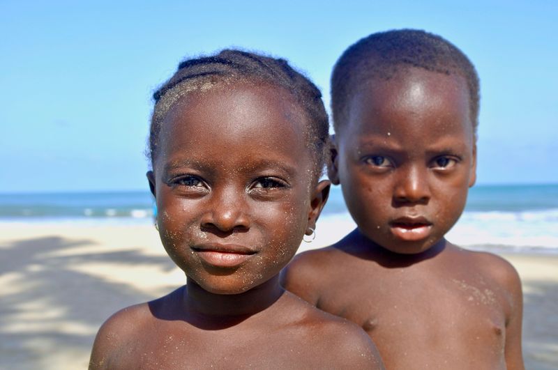 Portrait of girl and  boy at beach