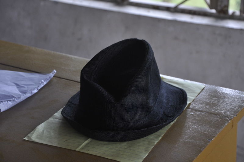 High angle view of hat on table