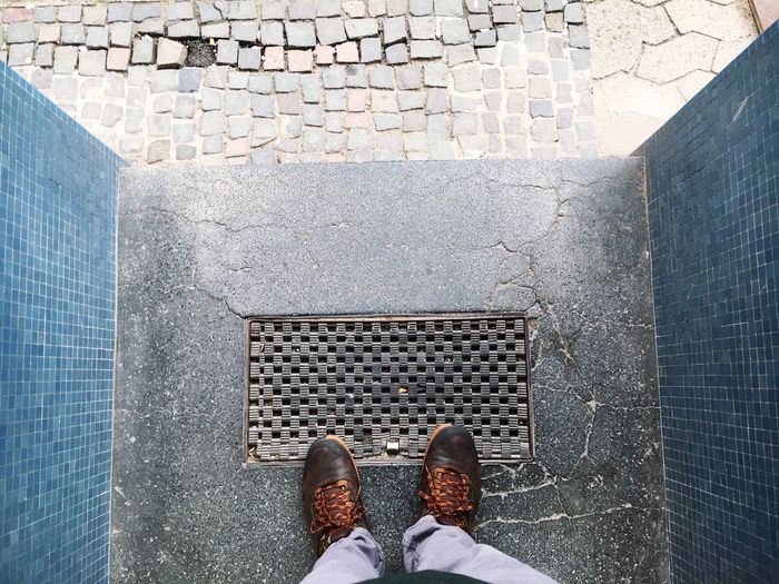 Low section of person standing on doorway