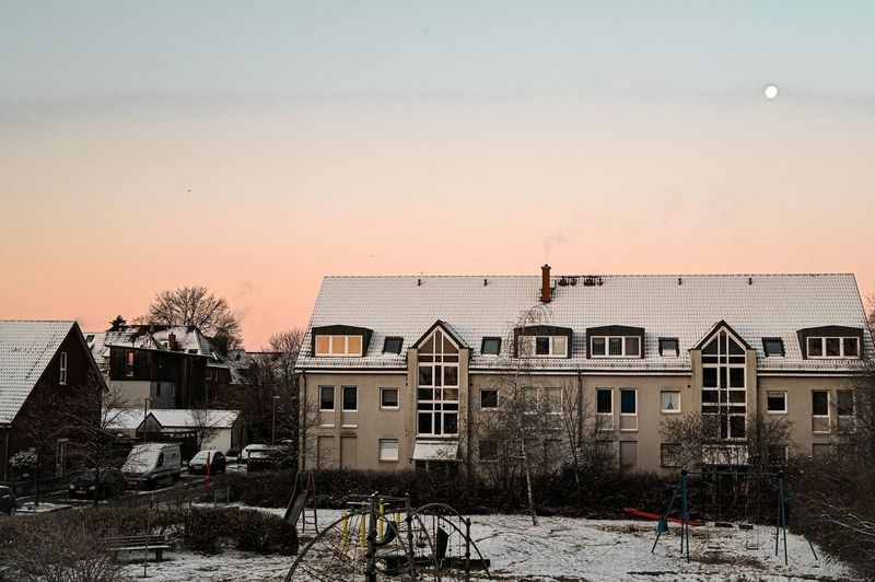 Buildings against sky during winter