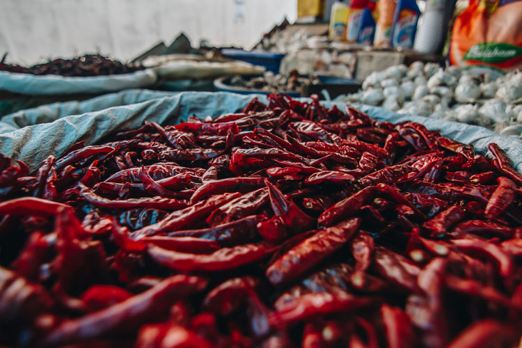 Close-up of red chili papers for sale at market stall