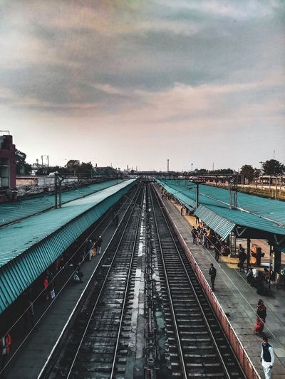 High angle view of railroad tracks against sky at sunset