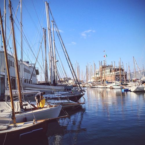 Boats moored at harbor