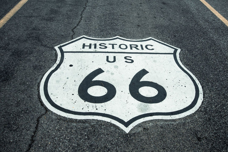 High angle view of arrow sign on road