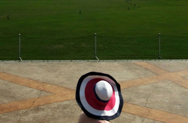 High angle view of ball on grassland against sky