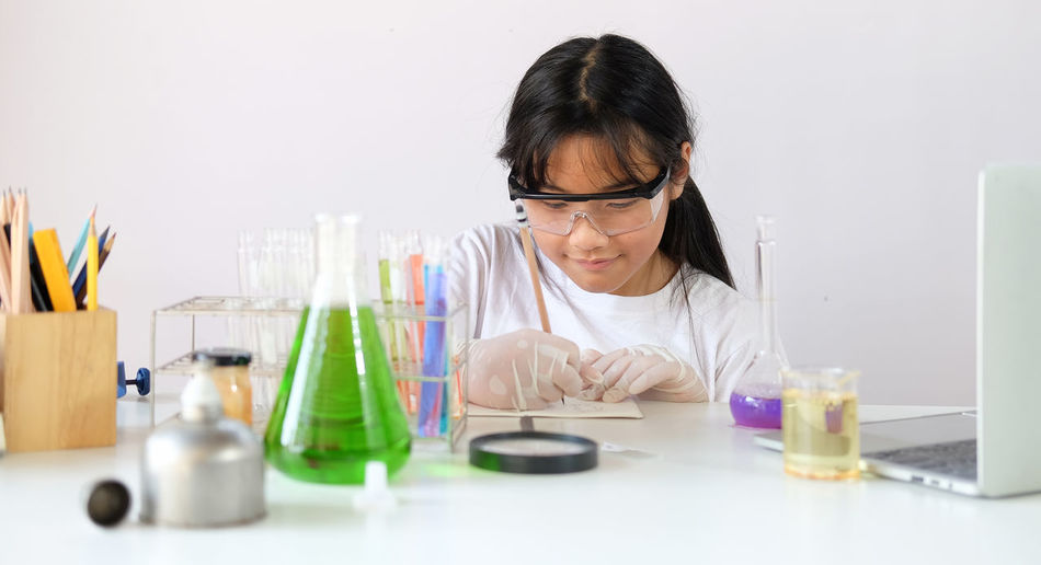Girl experimenting at laboratory