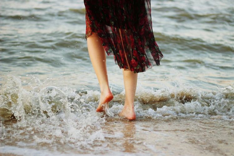 Low section of woman on beach
