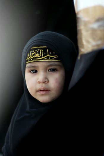 Portrait of cute girl wearing burka
