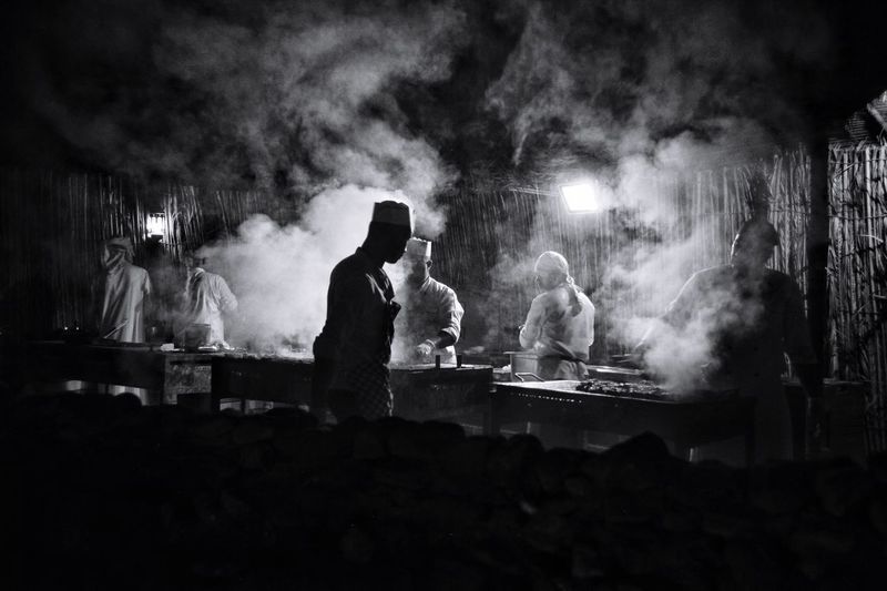 Chefs cooking at night