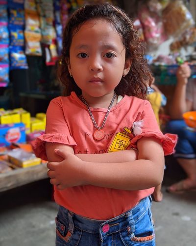 Portrait of cute girl standing outdoors