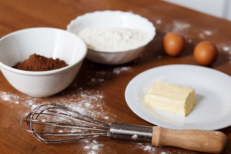 The ingredients needed for preparing homemade chocolate cupcakes