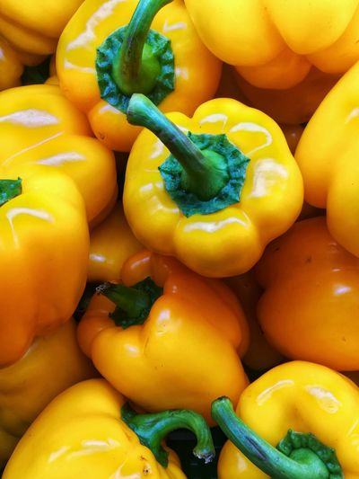 Full frame shot of yellow bell peppers for sale in market