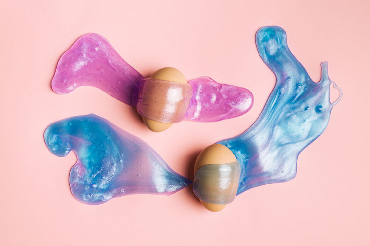 High angle view of multi colored candies against white background