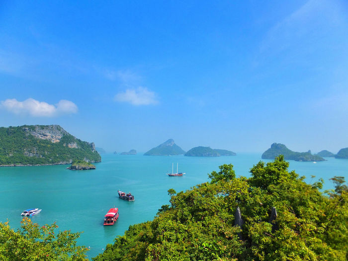 Scenic view of sea and mountains against sky at mu ko ang thong national park