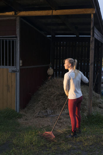 Woman raking hay