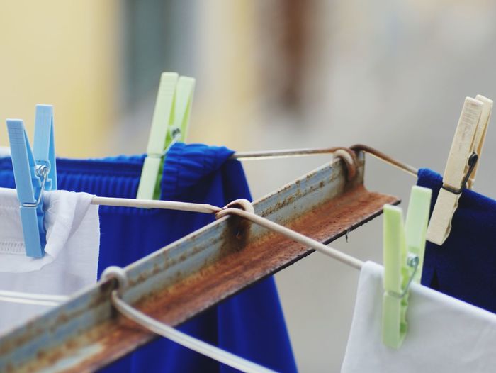 Close-up of laundry and clothespins over clothesline