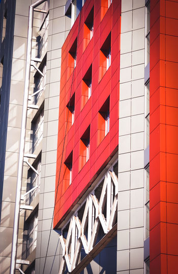 Facade, front of the house red and gray in the high-tech style different details on a bright sunny 