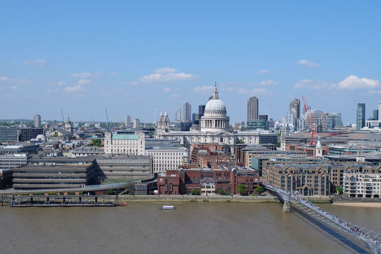 Buildings in city against sky