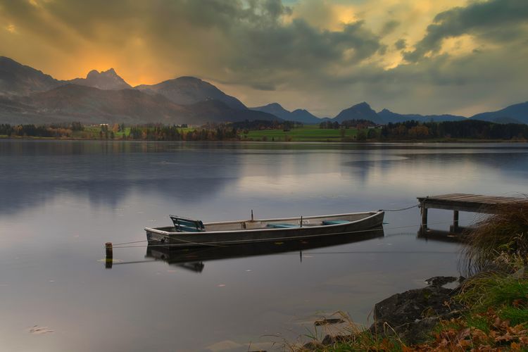 Scenic view of lake against sky during sunset