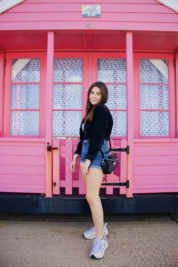 Pink beach hut with model