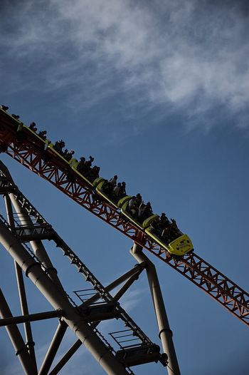 Low angle view of rollercoaster against sky