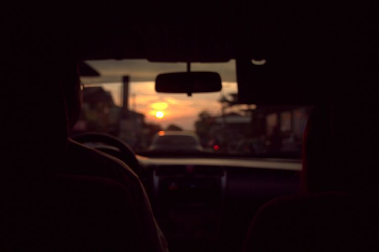 Sunset seen through train windshield