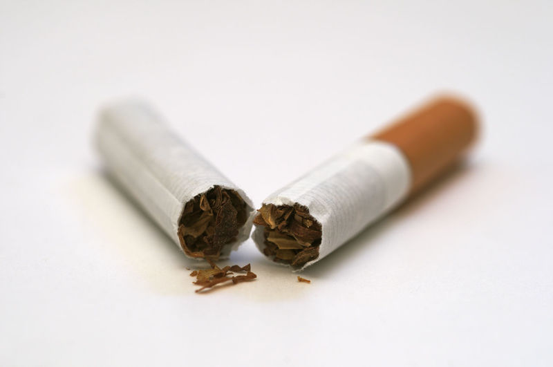 Close-up of cigarette ring on white background