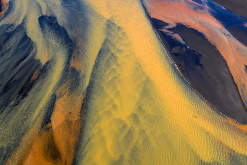 Colorful glacier rivers on the south coast of iceland with black sand