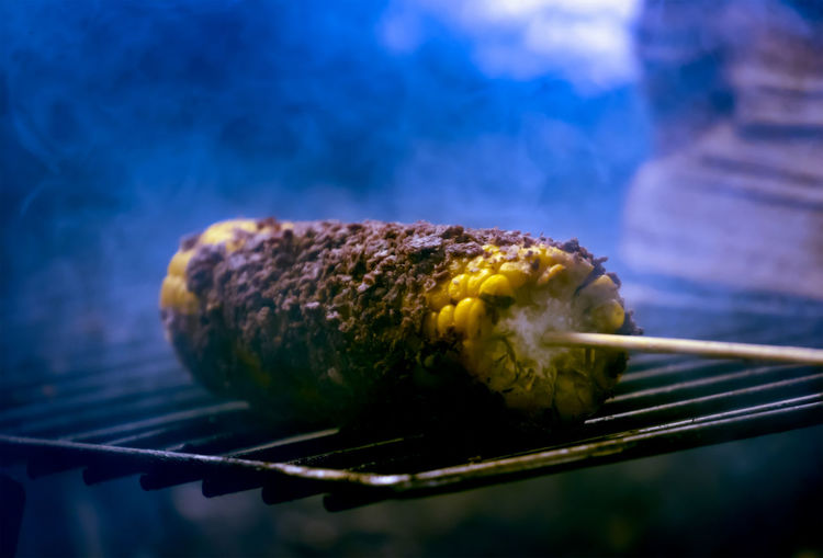 Close-up of corn on barbecue