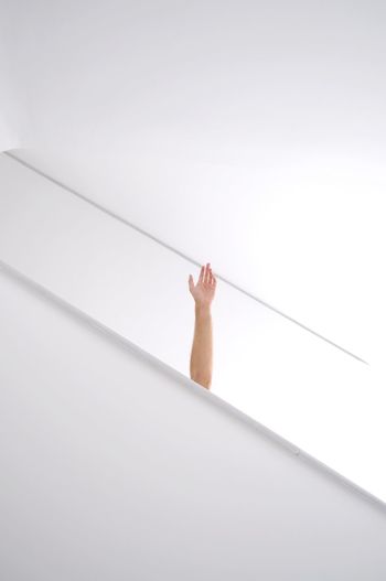 LOW ANGLE VIEW OF MAN AGAINST SKY