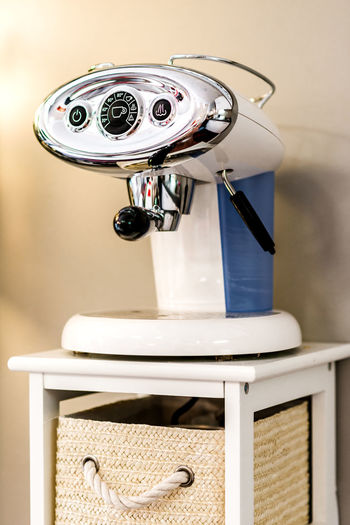 Close-up of coffee maker on table at home