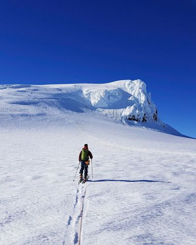 Man skiing on snow covered mountain