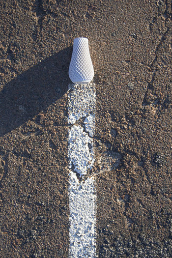 High angle view of art vase on road
