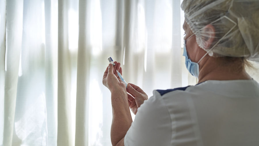 Doctor's hands with covid vaccine